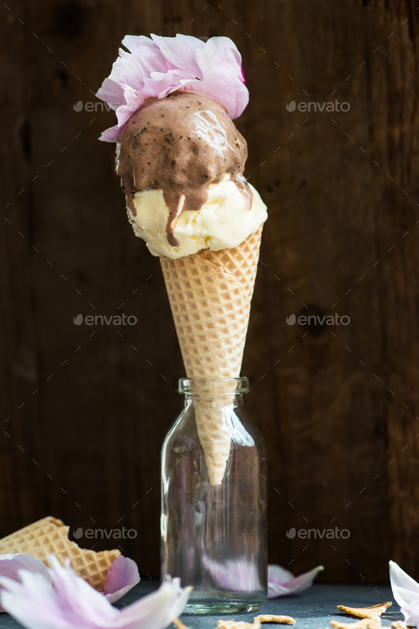 Chocolate and Vanilla Ice Cream Scoops in Waffle Cones - Stock Photo - Images