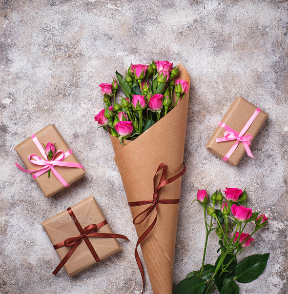 Pink roses bouquet and gift boxes