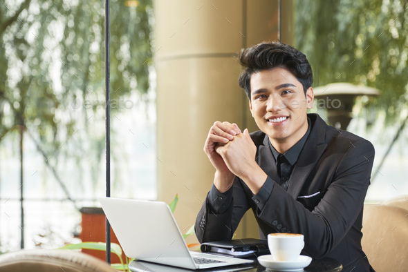 Cheerful Asian Businessman In Cafe - Stock Photo - Images