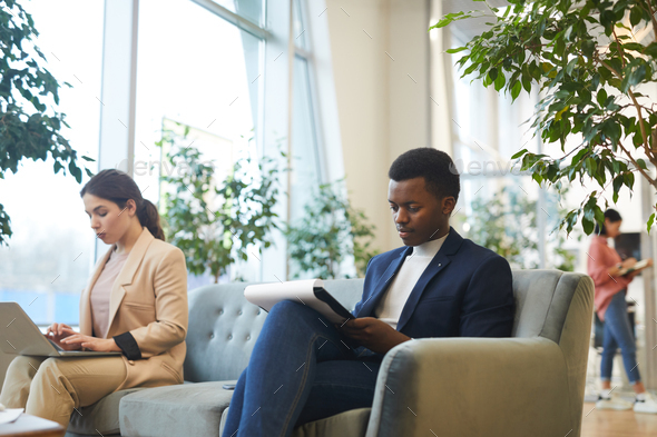 Successful African Businessman in Lounge Room - Stock Photo - Images