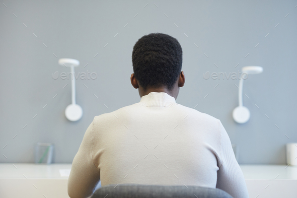 African-American Man Working in Office Back View