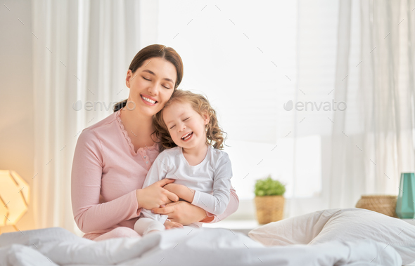 girl and her mother enjoy sunny morning