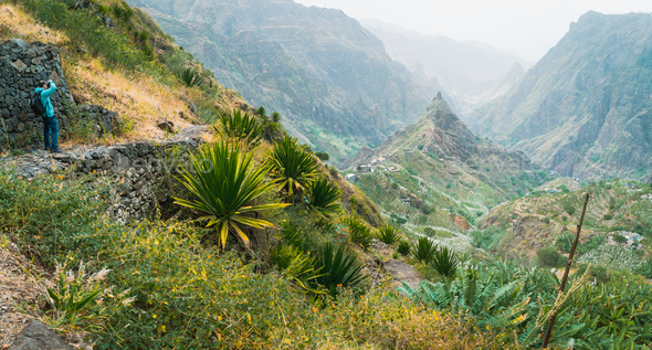 Photographer takes a picture of amazing lush Xo-Xo valley. Rugged Lombo de Pico in the middle. Santo - Stock Photo - Images