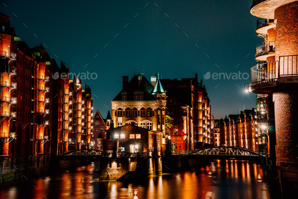 Hamburg, Germany. View of Wandrahmsfleet at dusk in light illumination. Located in Warehouse - Stock Photo - Images
