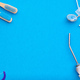 Dentist tools over blue background top view Stock Photo by haveseen