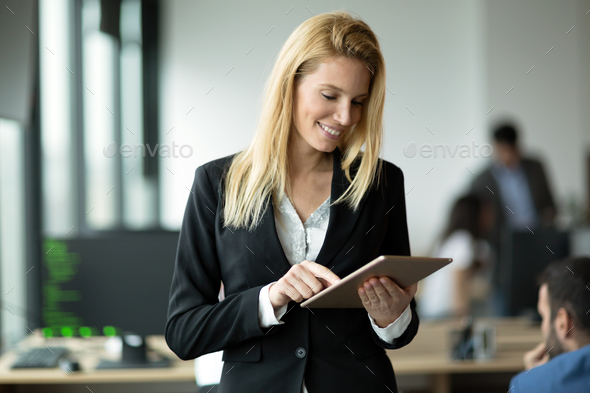 Businesswoman using tablet at information technology office