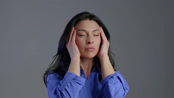 Bored Mature Woman with Long Hair Having Headache, Studio Portrait alt