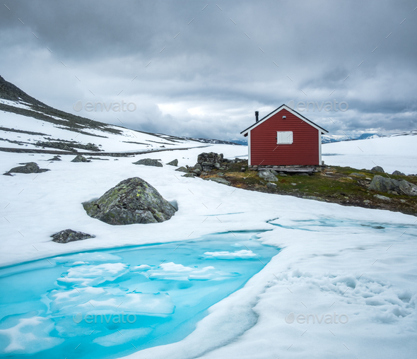 Typical norwegian red wooden house - Stock Photo - Images