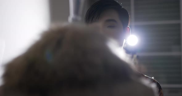 Professional fashion designer man looking mannequin model alt