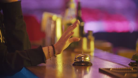 A Person Rings the Bell on the Bartender Stand Several Times, Bartender Putting the Drink on the alt