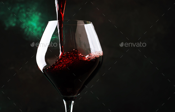 red wine poured into large wine glass