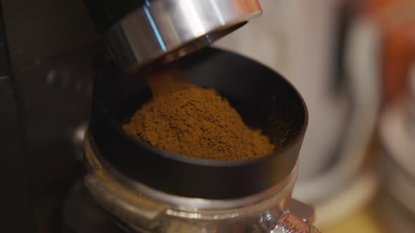 Professional Barista Worker Man Using Grinder Machine To Grind Fresh Coffee Beans for Make Hot alt