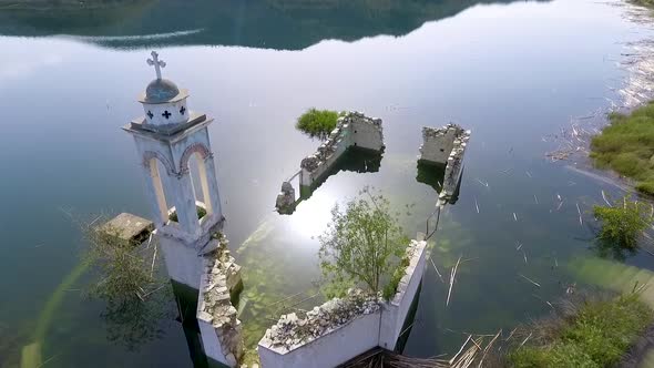 Abandoned old church immersed under reservoir water in Cyprus alt