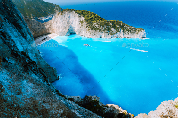 Navagio beach or Shipwreck bay with turquoise water and pebble white beach. Famous landmark location - Stock Photo - Images