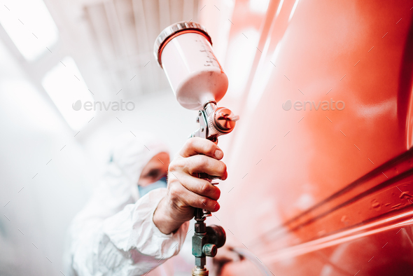 close up of male holding spray gun and painting a car Stock Photo by  stockcentral