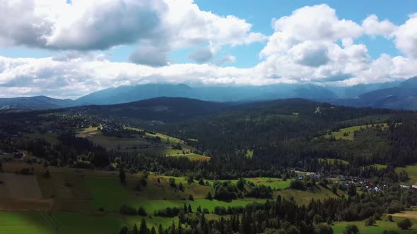 Flight Over a Mountain Cottage Village in Poland, Zakopany, Tatra National Park Aerial 4K Video alt