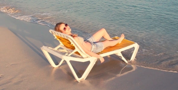 Girl On The Beach Chair