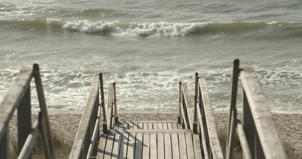 Boardwalk to the beach of Sylt with the Northsea in the background 4k 60fps alt