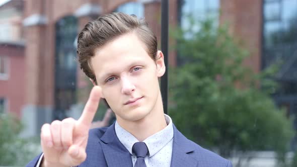 Gesture of No by Waving Finger, Young Businessman Portrait alt