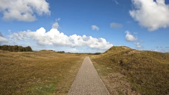 Walking along a hiking path in the nature reserve Norderney Germany alt