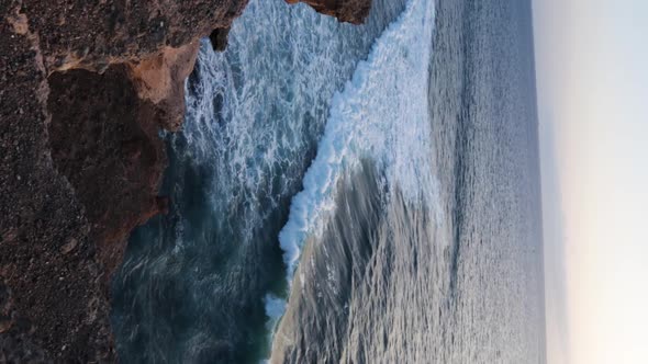 Waves crashing into the rocks during the golden hour, Tenerife alt