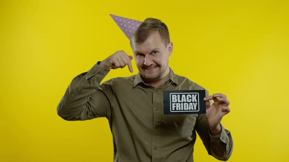 Attractive Man Showing Black Friday Text Inscription. Holiday Discounts, Low Prices alt