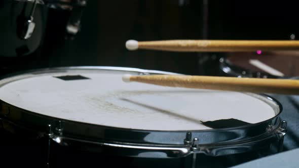 The Drummer Plays with Sticks on a Snare Drum Home Lesson Training alt