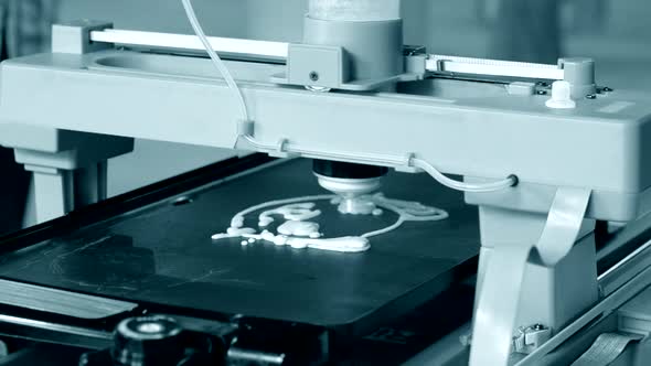 3D Printer Printing Pancakes with Liquid Dough Different Shapes Closeup alt