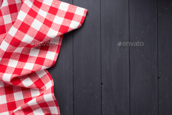 cloth napkin or tablecloth checked at wooden plank board table