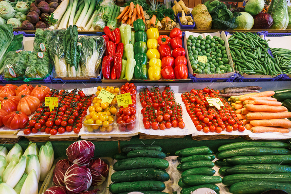 Fruit and vegetable market. Lots of different fresh fruits and vegetables.  Stock Photo by EwaStudio
