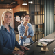 Businesswomen talking with coworkers during an office meeting - PhotoDune Item for Sale