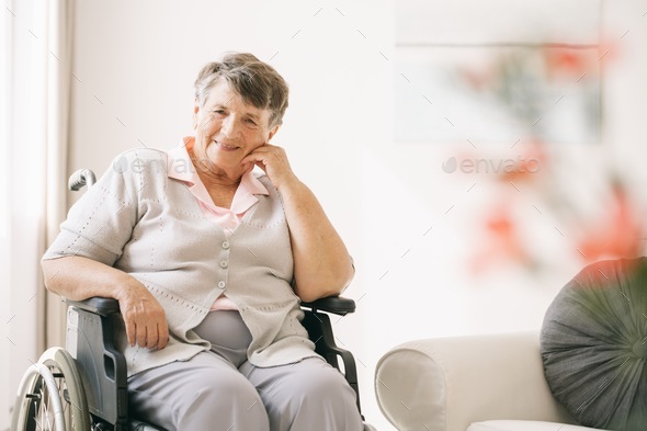 Woman on a wheelchair - Stock Photo - Images