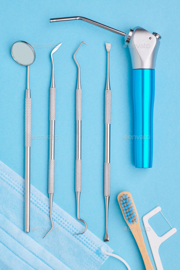 Dentist tools over blue background top view Stock Photo by haveseen