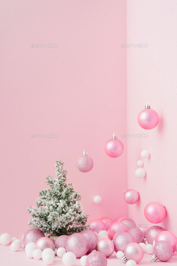 Creative Christmas design pink pastel color background with Christmas tree.  New Year concept. Stock Photo by zamurovic