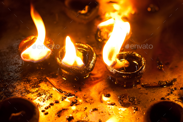 Burning oil lamps at religious temple. India - Stock Photo - Images