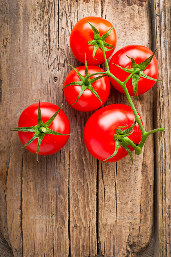 Fresh tomatoes on vintage wooden table Stock Photo by PerfectLazybones