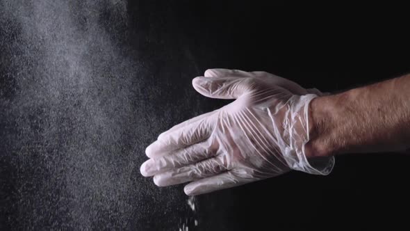 Close Up Of A Chef Wiping Flour From Hand alt