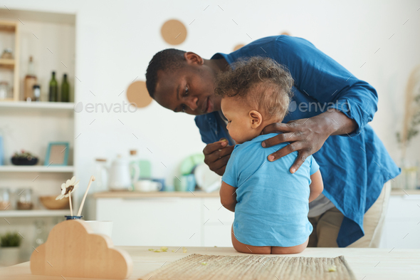 African-American Father Caring for Baby Boy