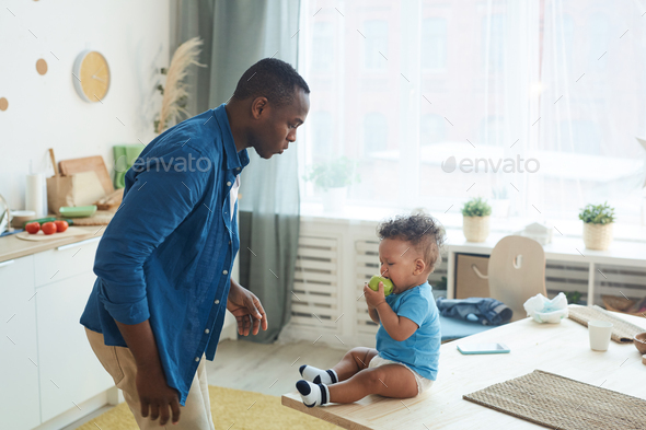 Father Trying to Calm Crying Baby