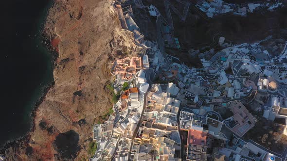Aerial shot of famous Oia village in Santorini at sunrise in Greece alt