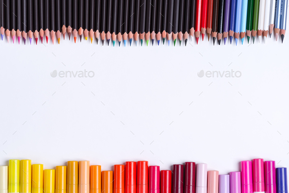 Painting multicolored border from colorful markers and pencils for art creativity on a white