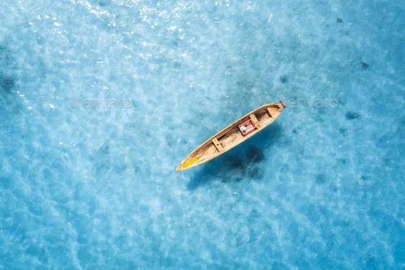Aerial view of the fishing boat in transparent blue water Stock Photo by  den-belitsky
