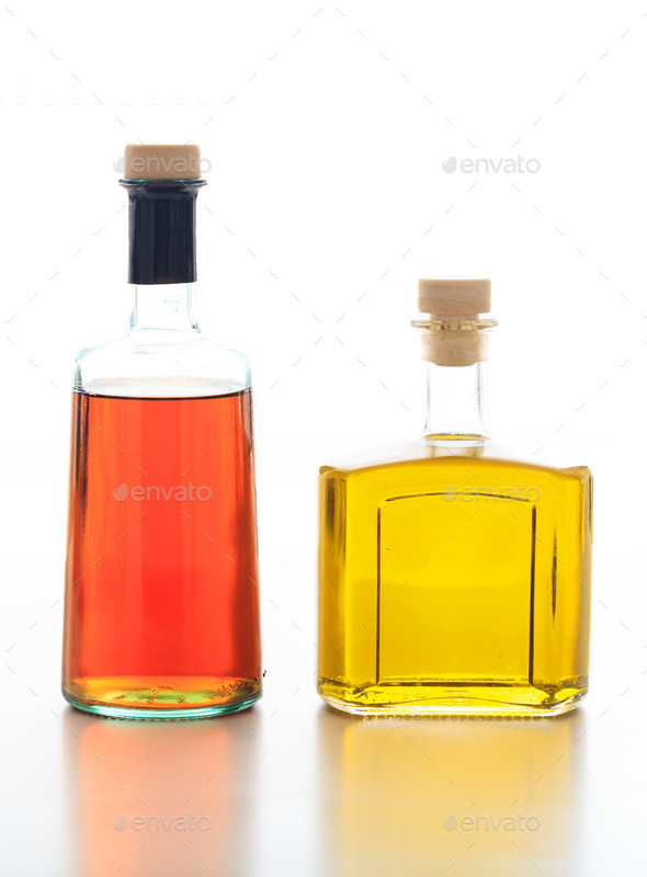Olive oil and vinegar bottled isolated against white background. Stock