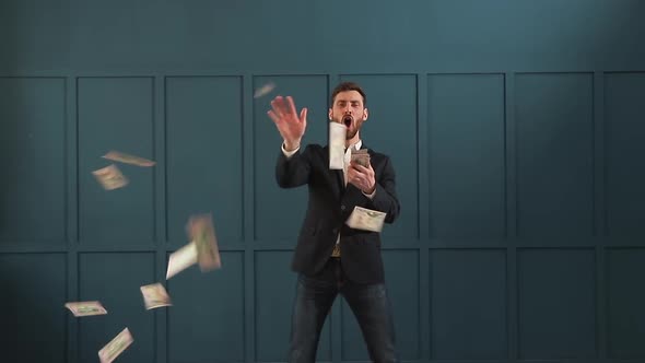 Young Happy Businessman Dancing and Throwing Money. Slow Motion. Successful Business or Winning the alt