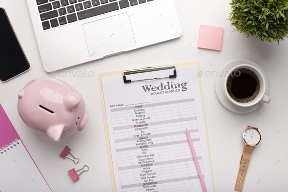 Wedding budget planning on workplace with laptop