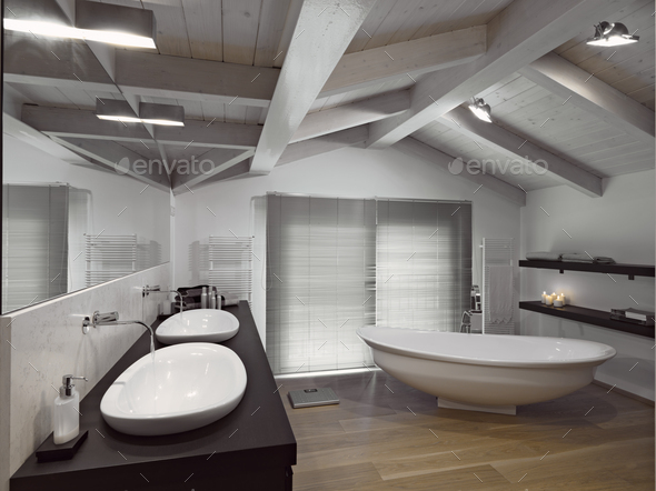 Interiors of a Modern Bathroom in the Attic With Wood Floor