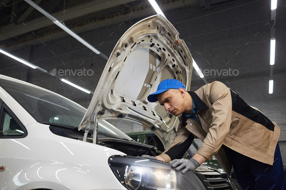 Auto Service Worker Checking Vehicle Health