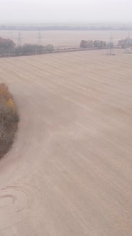 Vertical Video of a Field with Plowed Land in Autumn Slow Motion alt
