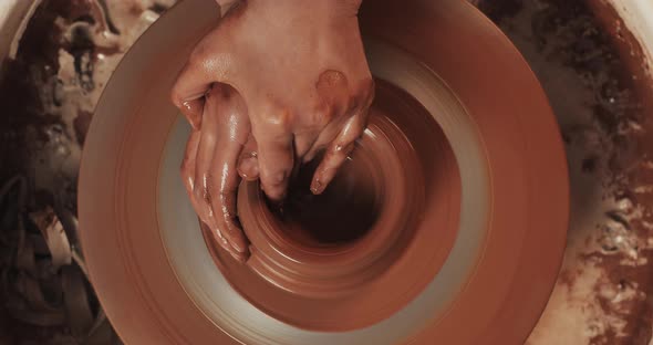 Potter Makes Pottery From Clay alt