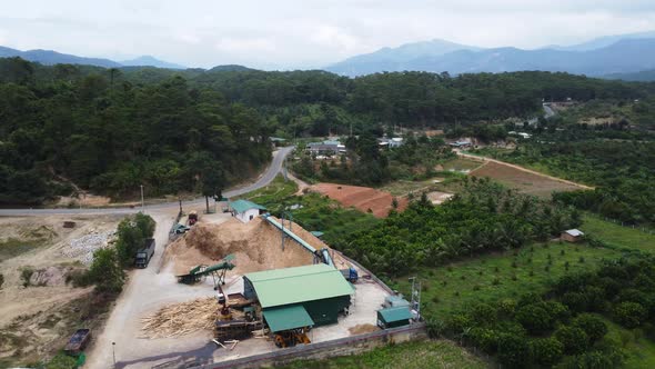 Logging and timber processing place in Vietnam. Aerial circling alt